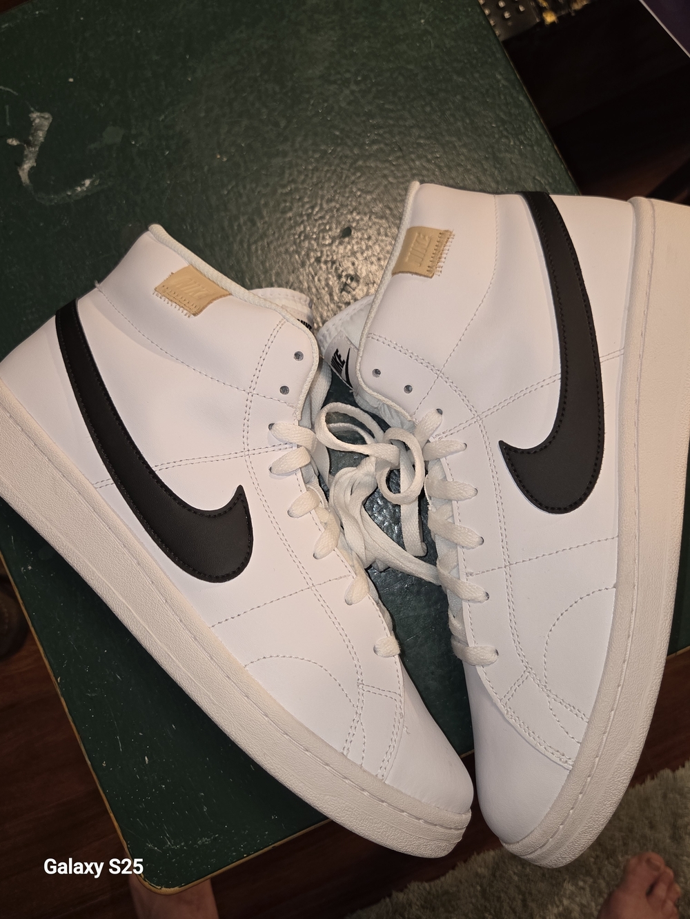 Nike White High-Top Sneakers with Black Swoosh and Tan Heel Tab